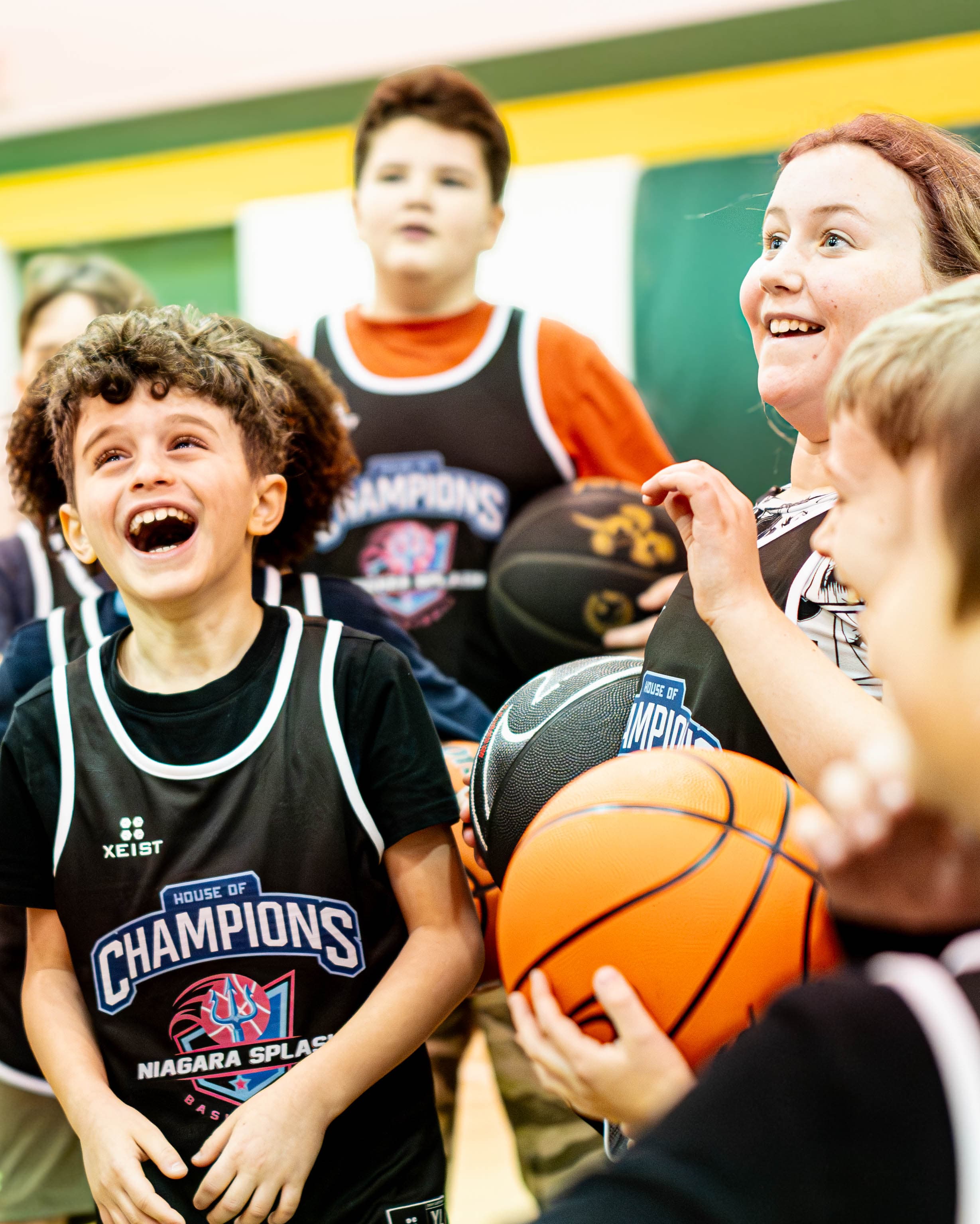 Young athlete laughing with coach at Niagara Splash