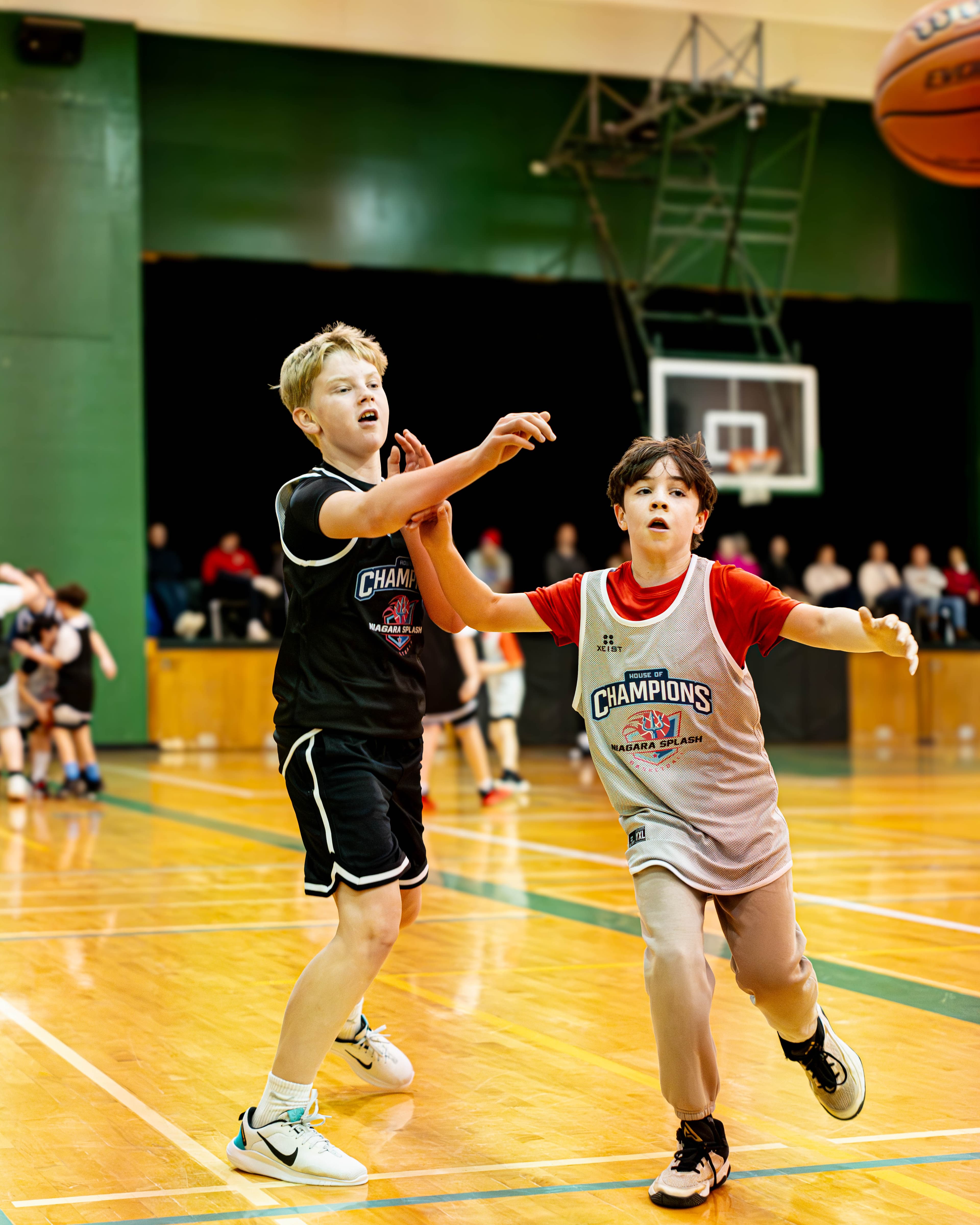 Kids playing house league basketball